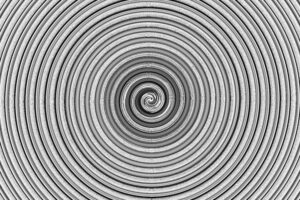 Intricate monochrome spiral design creates a mesmerizing abstract visual effect.