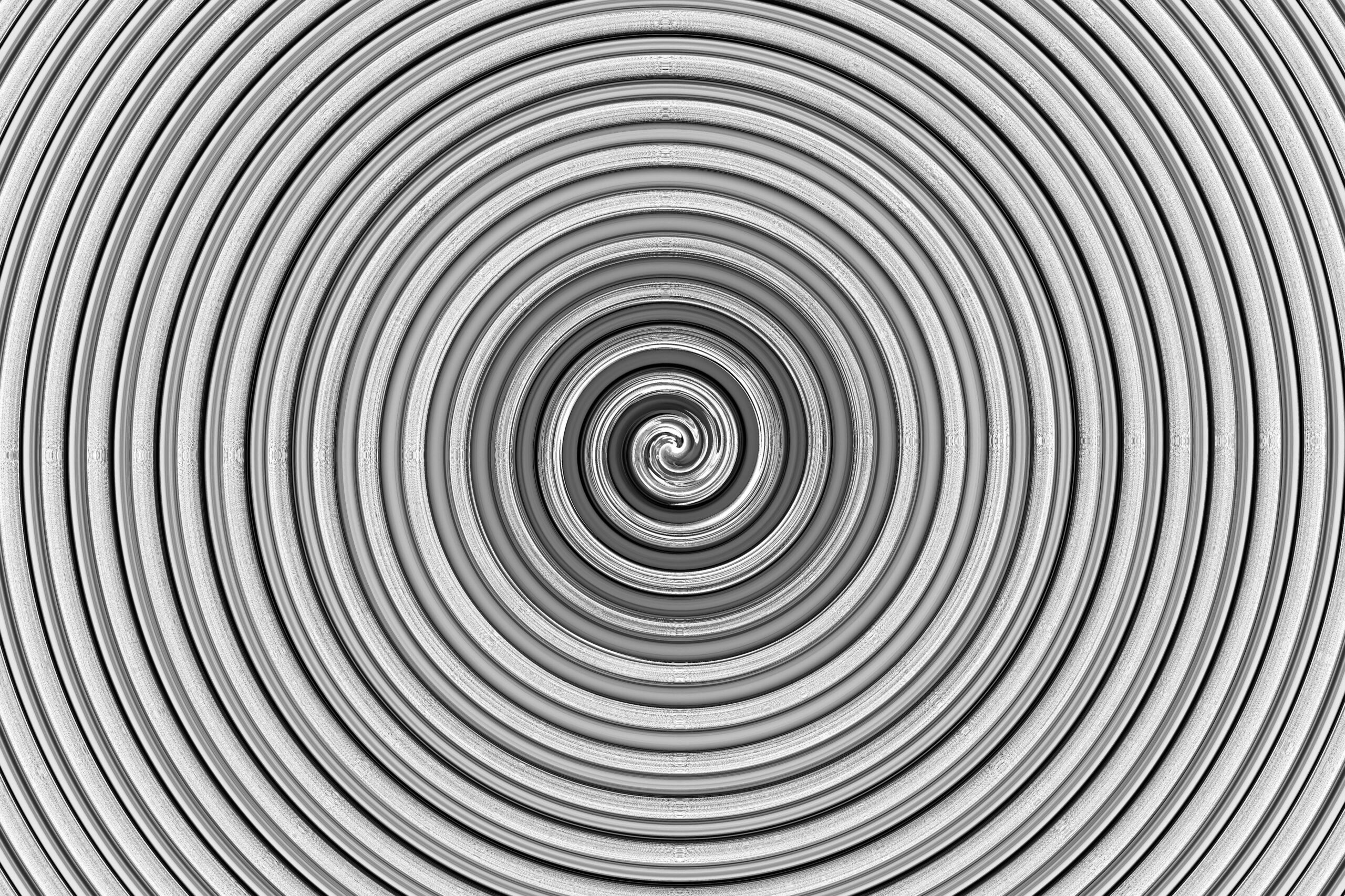 Intricate monochrome spiral design creates a mesmerizing abstract visual effect.